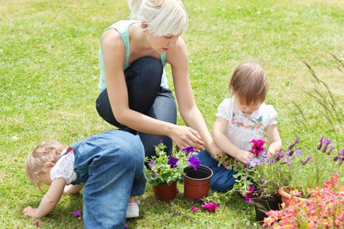 Gardener pruning shrubs and trees